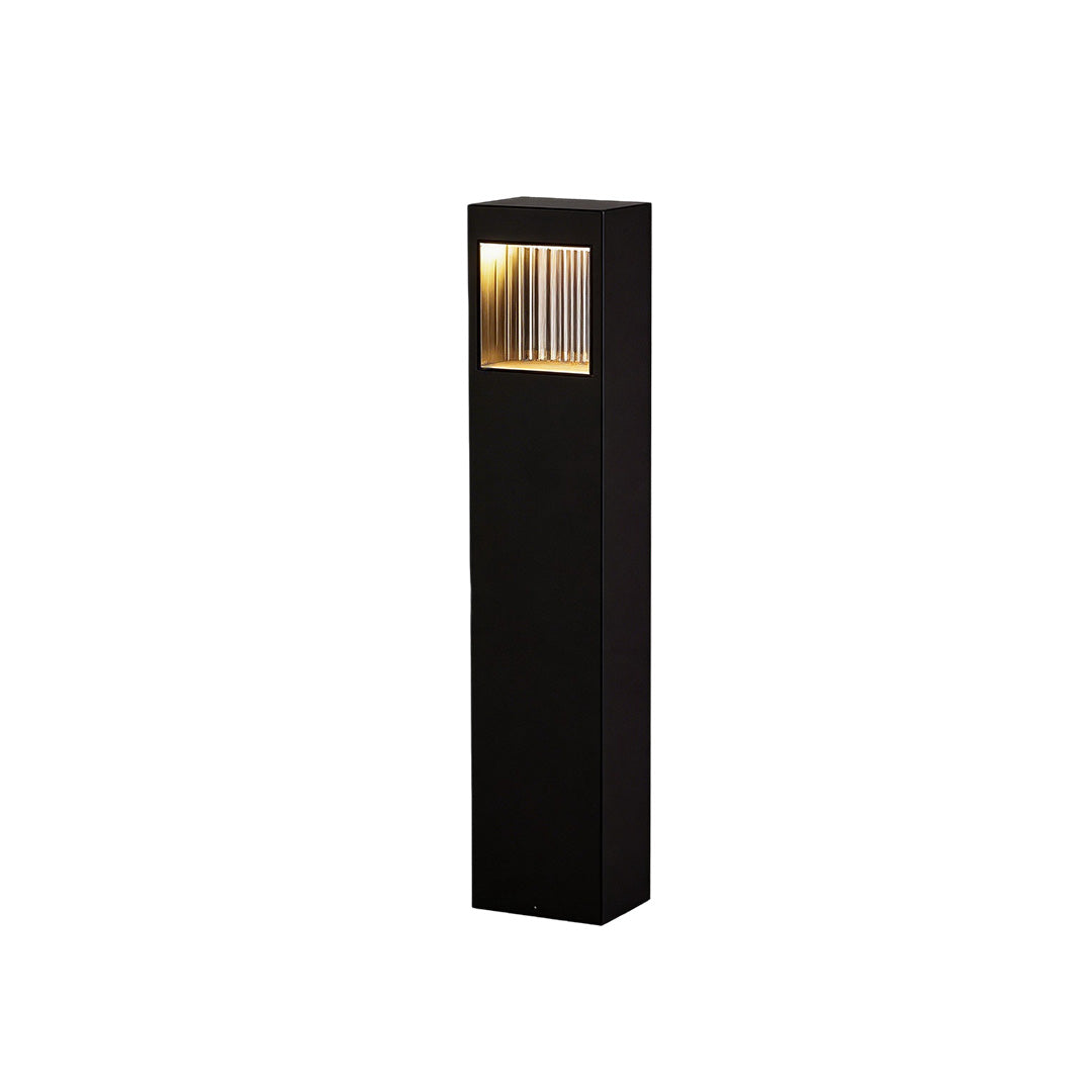 Bollard garden lights with a modern design, placed along a garden walkway.