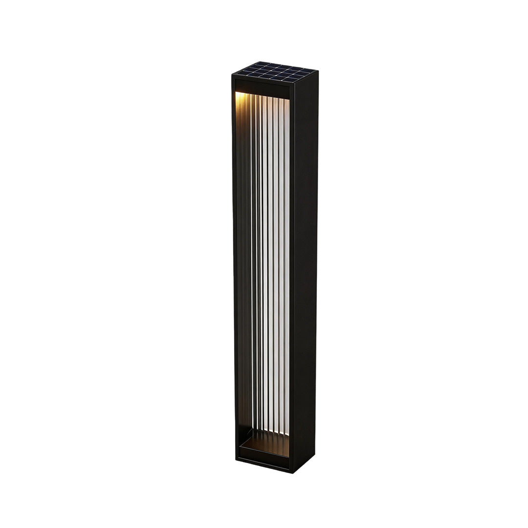 Bollard garden lights with a sleek design, illuminating a backyard.