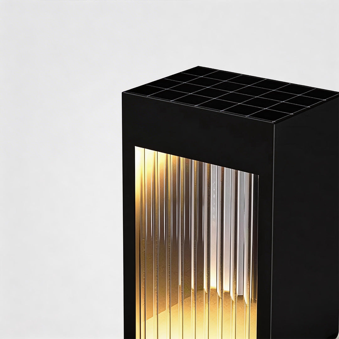 Bollard garden lights with a sleek design, placed on a concrete surface.