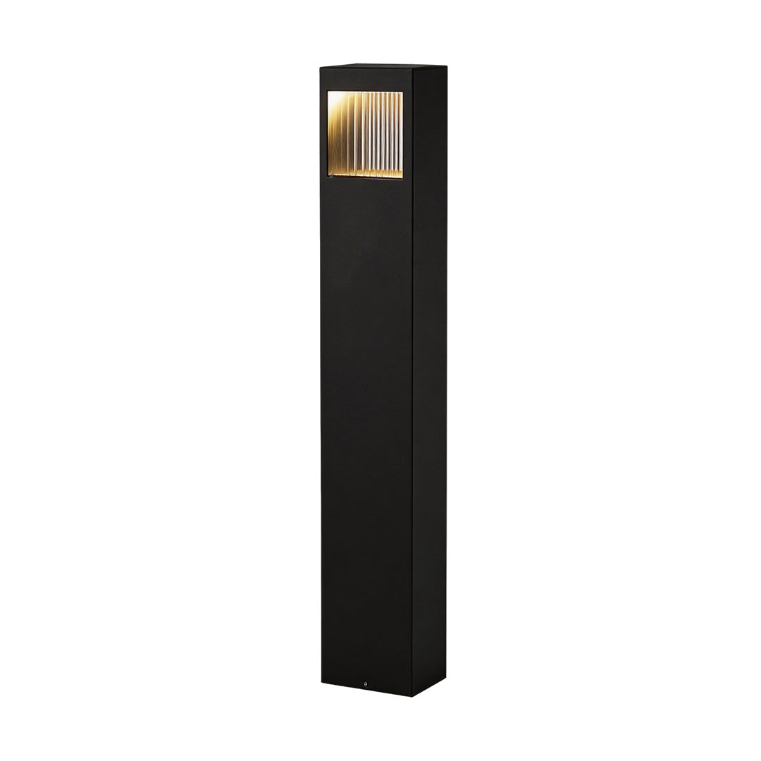 Bollard garden lights with a sleek design, enhancing a modern exterior.