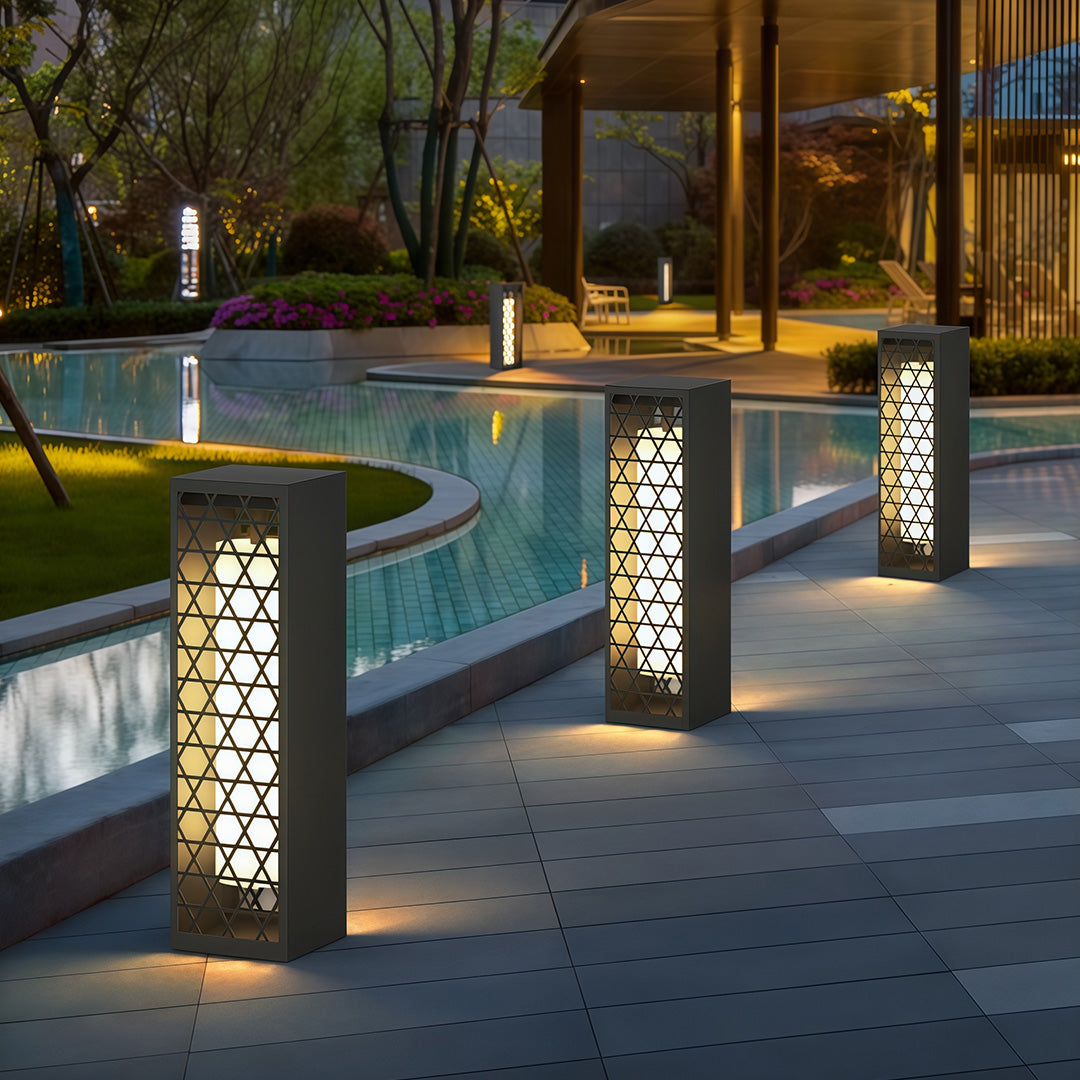 Close-up view of a bollard landscape light showing its detailed geometric pattern, designed for stylish outdoor lighting.