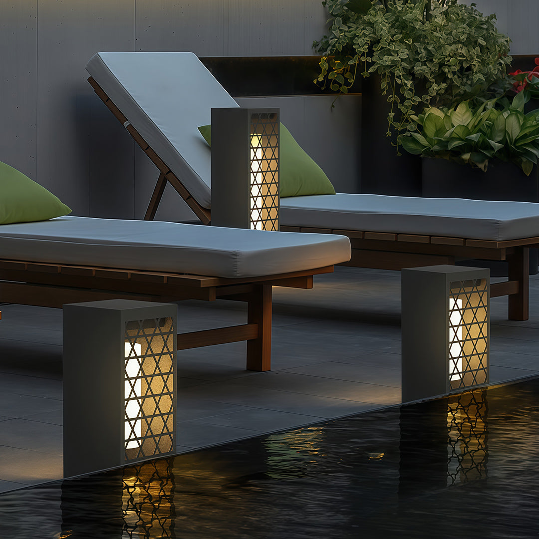 Bollard lighting along a garden border, creating an elegant and inviting atmosphere for outdoor gatherings.