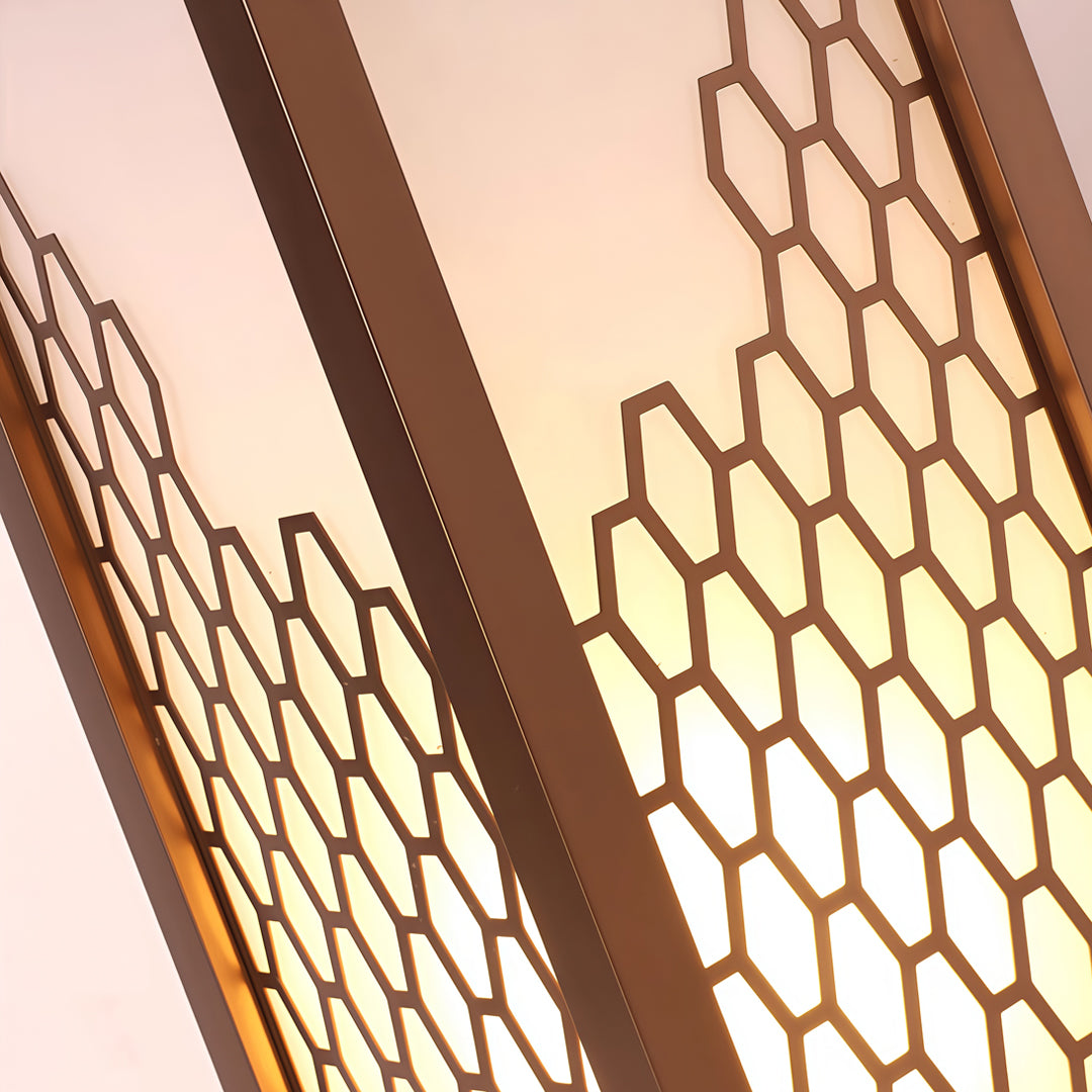 Close-up view of decorative metal mesh pattern used in modern bollard lighting fixtures.