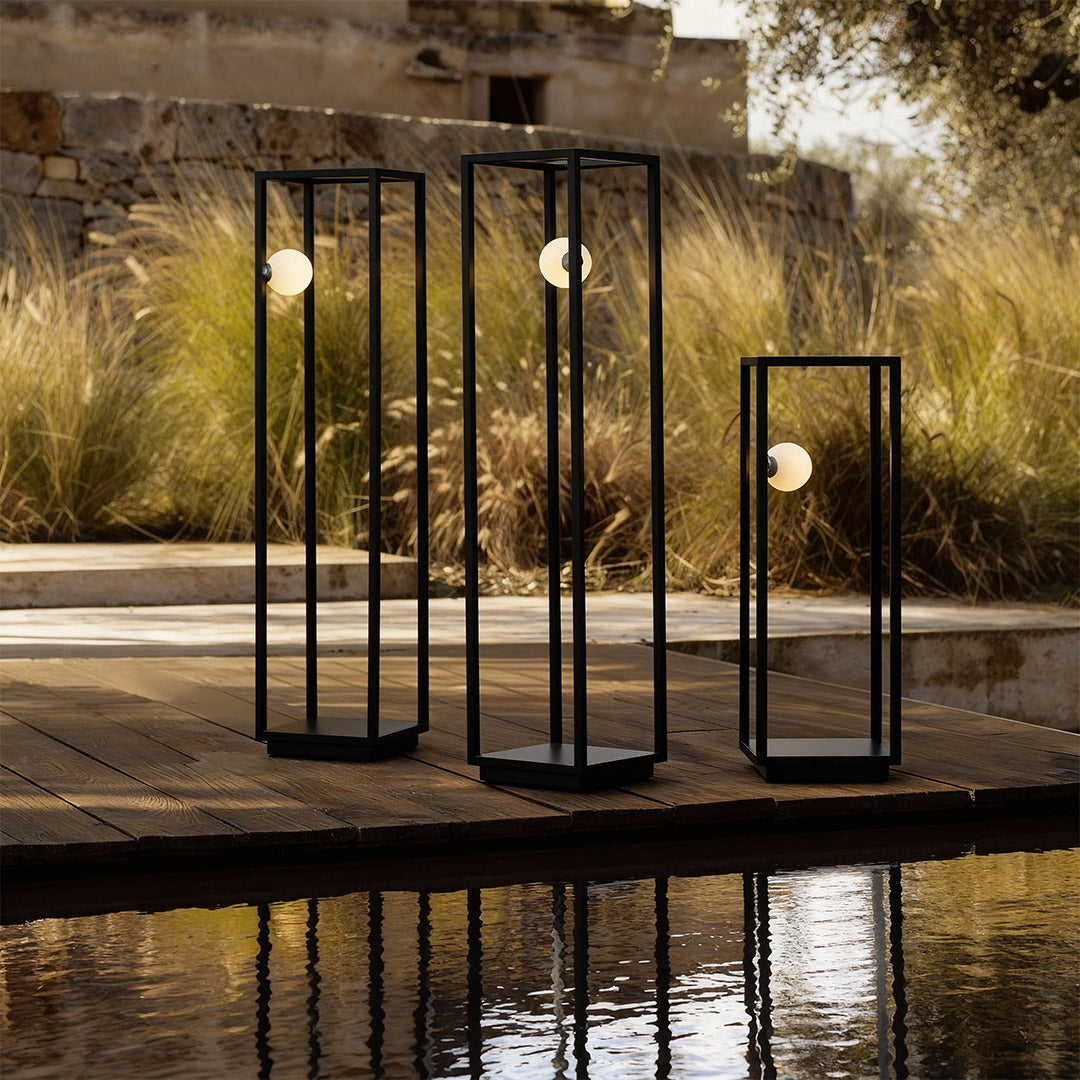 Bollard lighting illuminating a stone pathway, blending modern design with functional outdoor lighting.