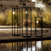 Bollard lighting illuminating a stone pathway, blending modern design with functional outdoor lighting.