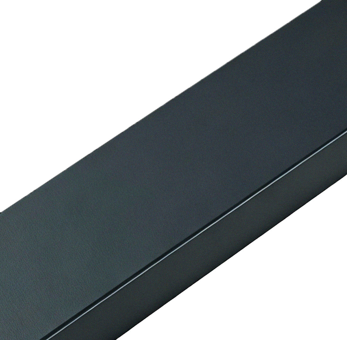 Close-up of a bollard path light, highlighting its angular design and black finish.