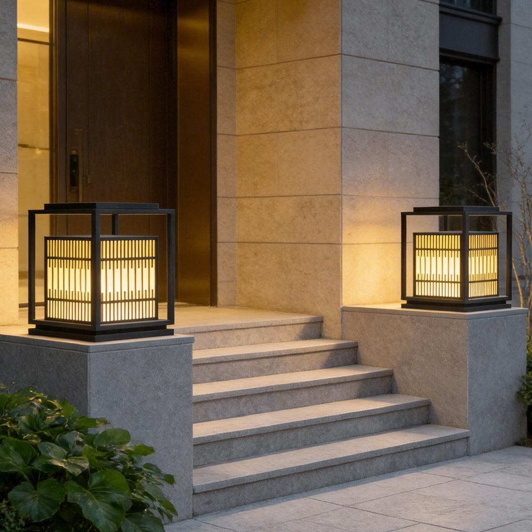 Bollard path lights enhancing a contemporary house entrance with elegant ambient light.