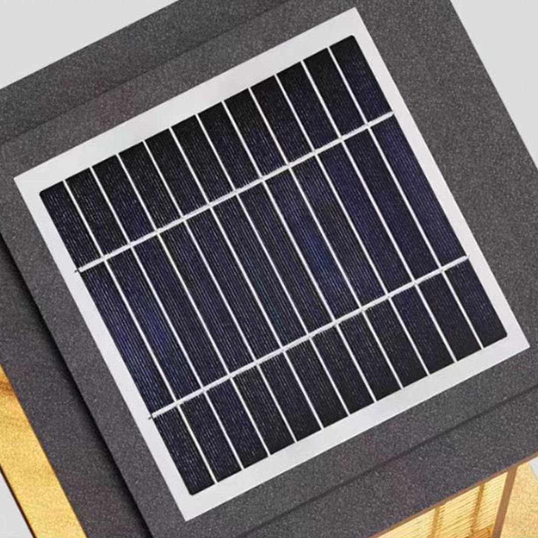 Close-up of bollard pathway lighting showcasing its frosted glass and metal frame.