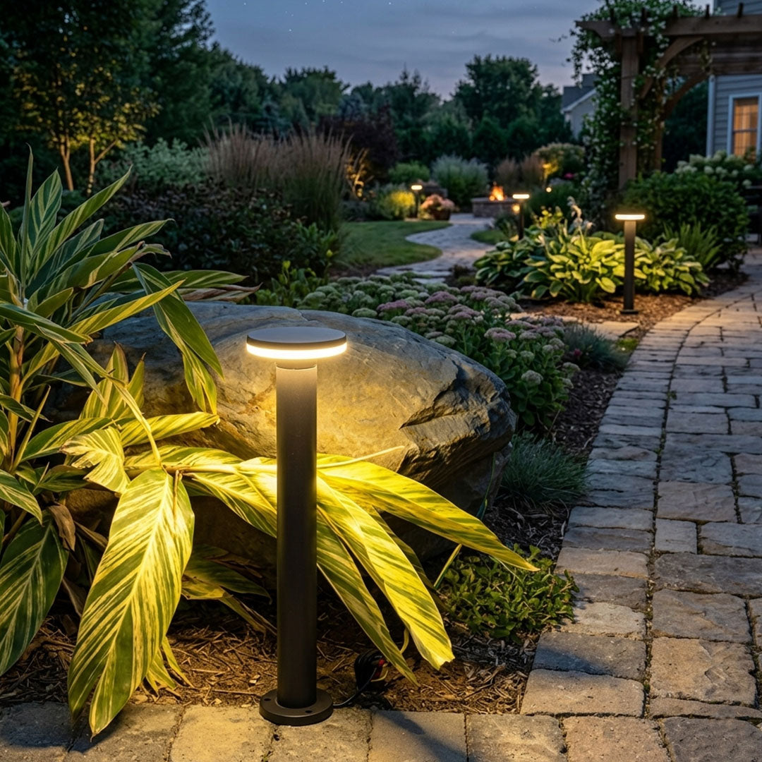 Modern round and square bollard lights provide decorative LED lighting that complements any outdoor landscape design.