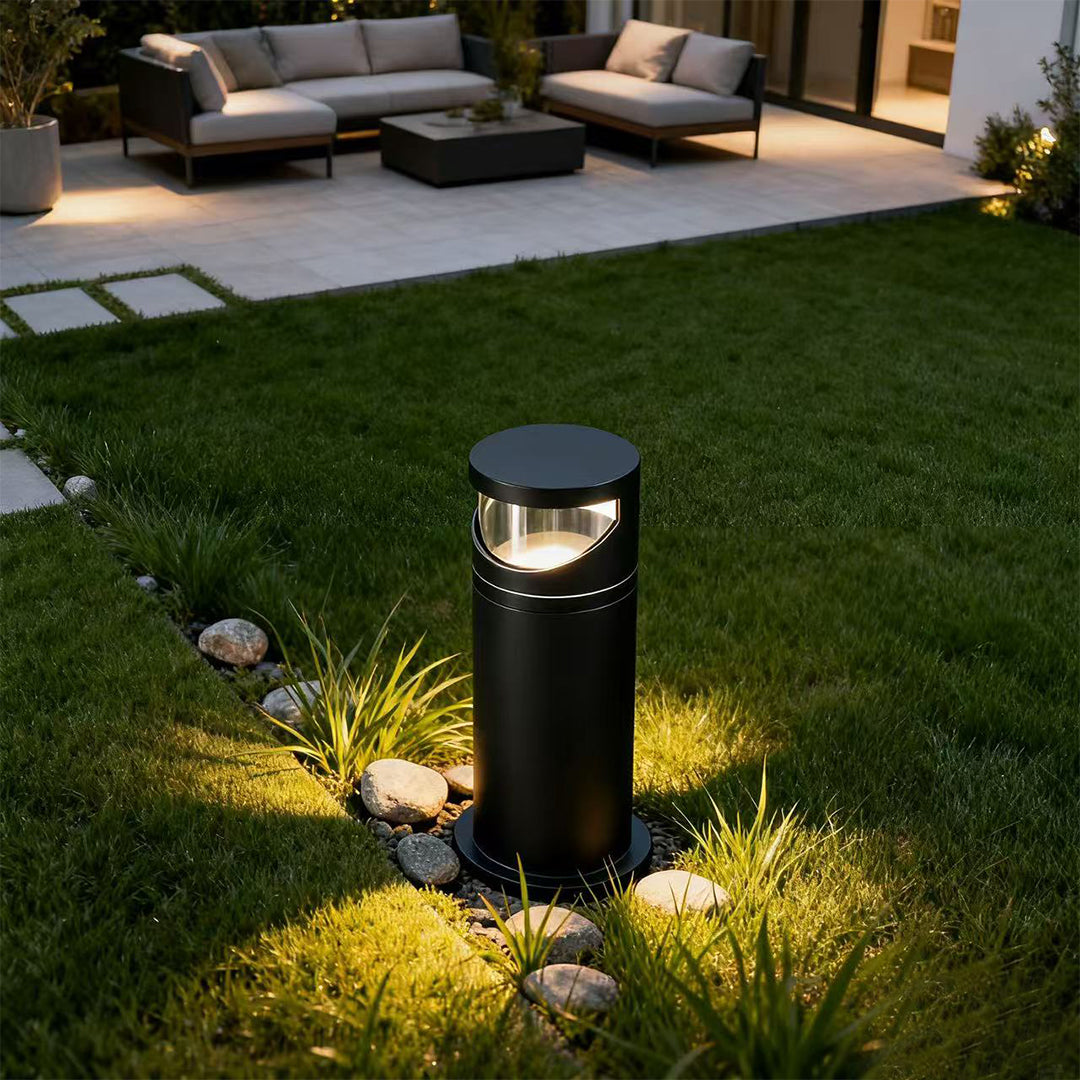 Bollard pathway lights flanking modern outdoor steps highlighting landscaping with downward directional illumination