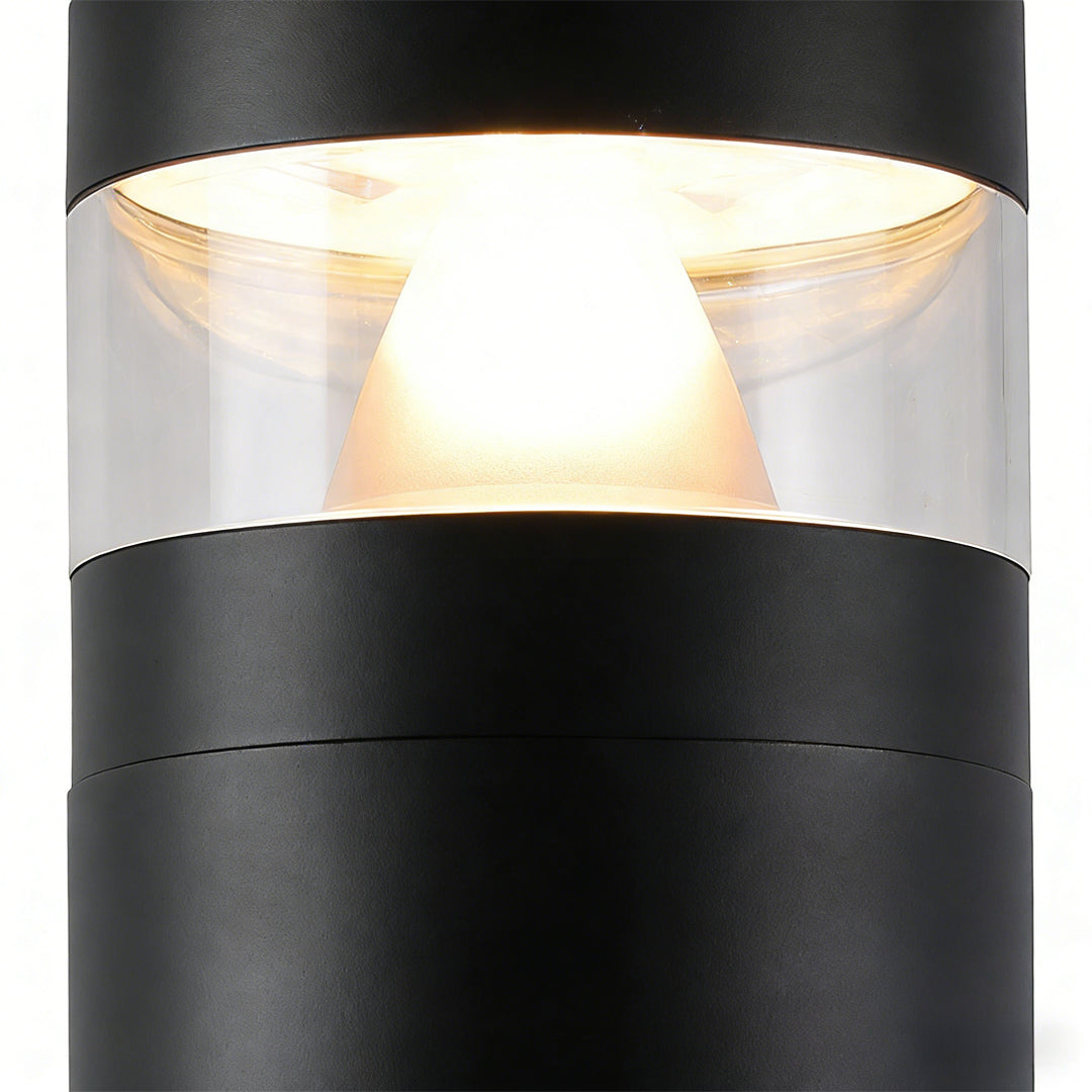 Close-up of bollards with lights showing the integrated LED source and clear cylindrical shade.