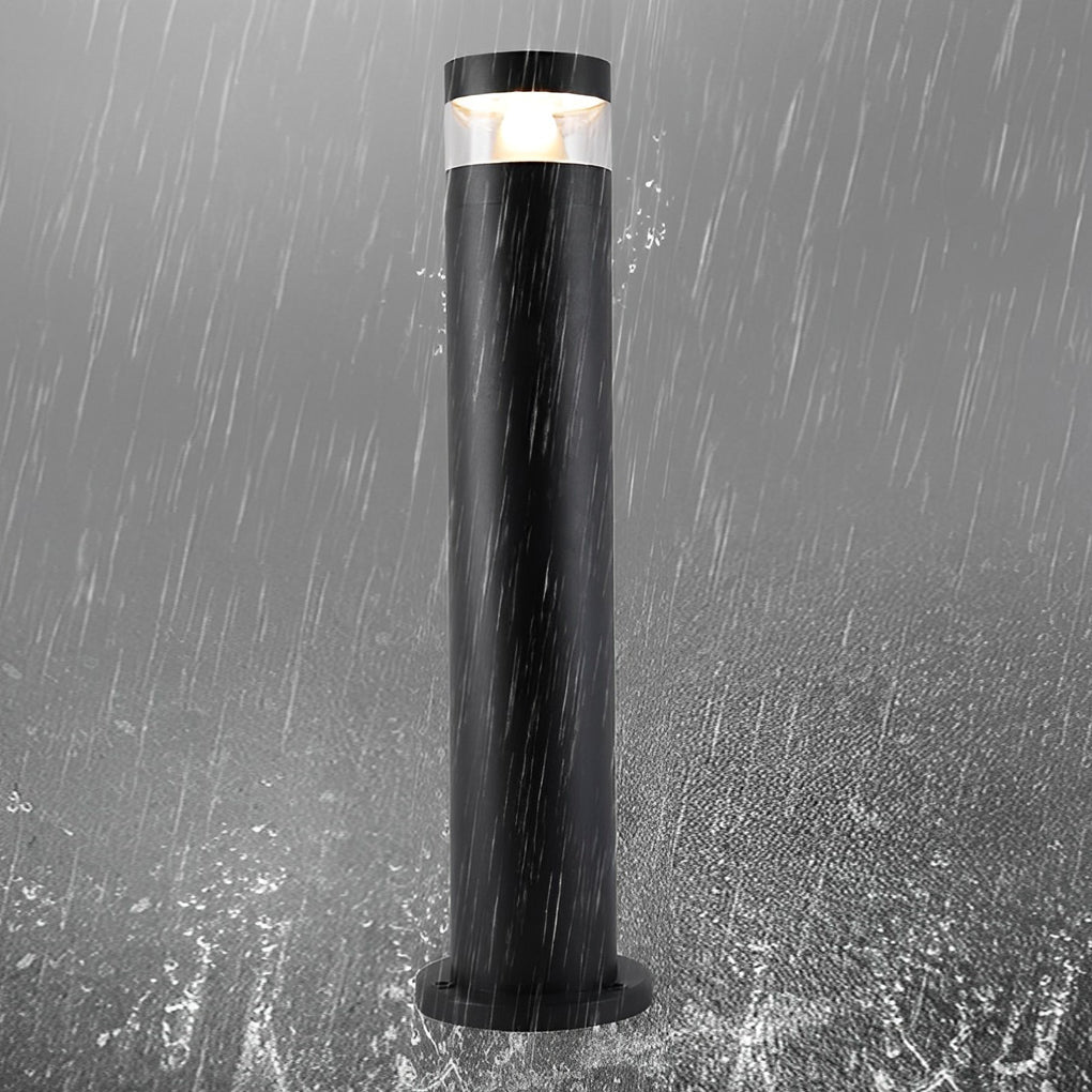 Bollards with lights shown in rainy weather with a waterproof black cylindrical outdoor design.