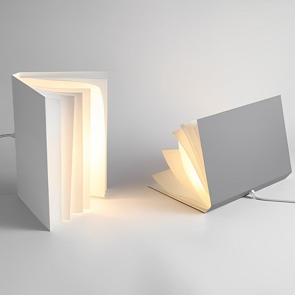 Close-up of book pendant light design showing folded panels emitting warm light with a minimalist aesthetic.