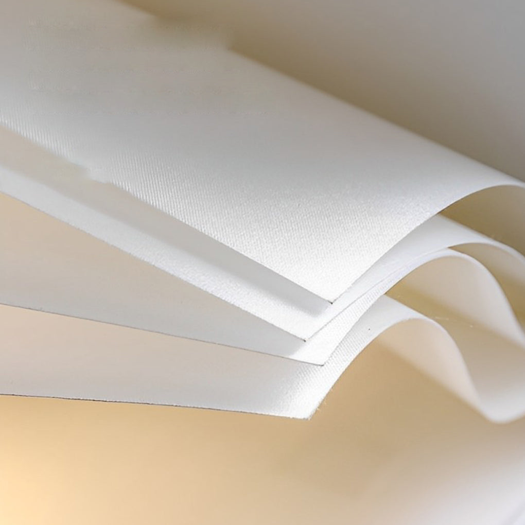 Macro view of book pendant light folded shade texture, highlighting refined materials and warm inner lighting.