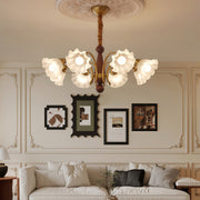 Bottom view of crystal vintage chandelier showing symmetrical arrangement of frosted flower shades and decorative ceiling medallion.