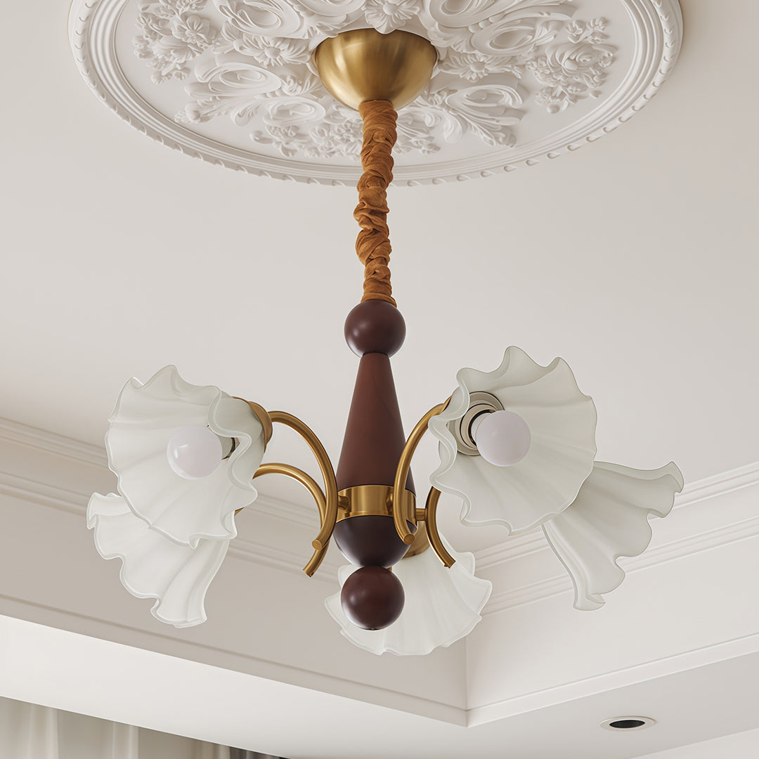 Bottom view of crystal vintage chandelier showing symmetrical arrangement of frosted flower shades and decorative ceiling medallion.