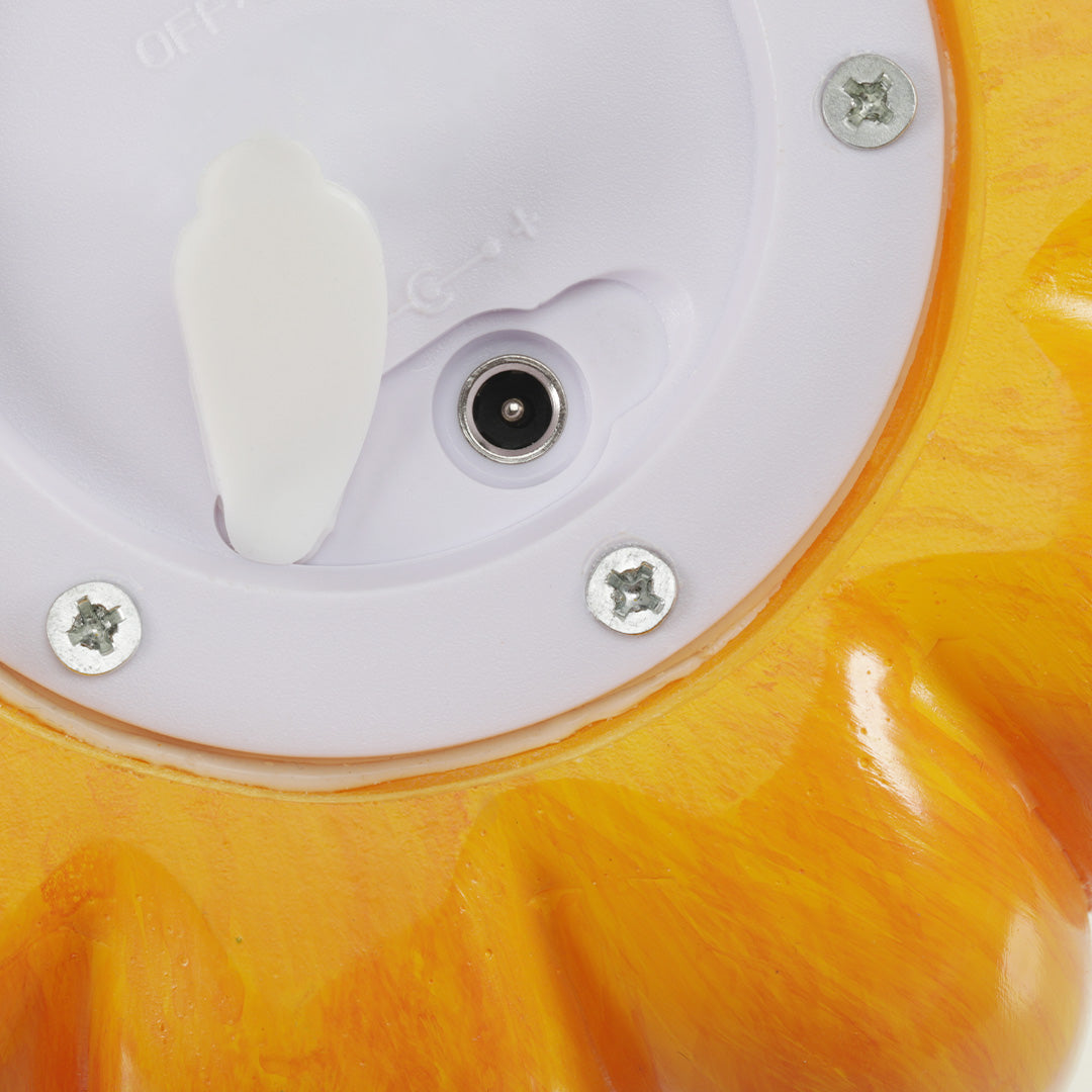 Bottom view of the halloween pumpkin light showing the power switch, charging port, and battery compartment.