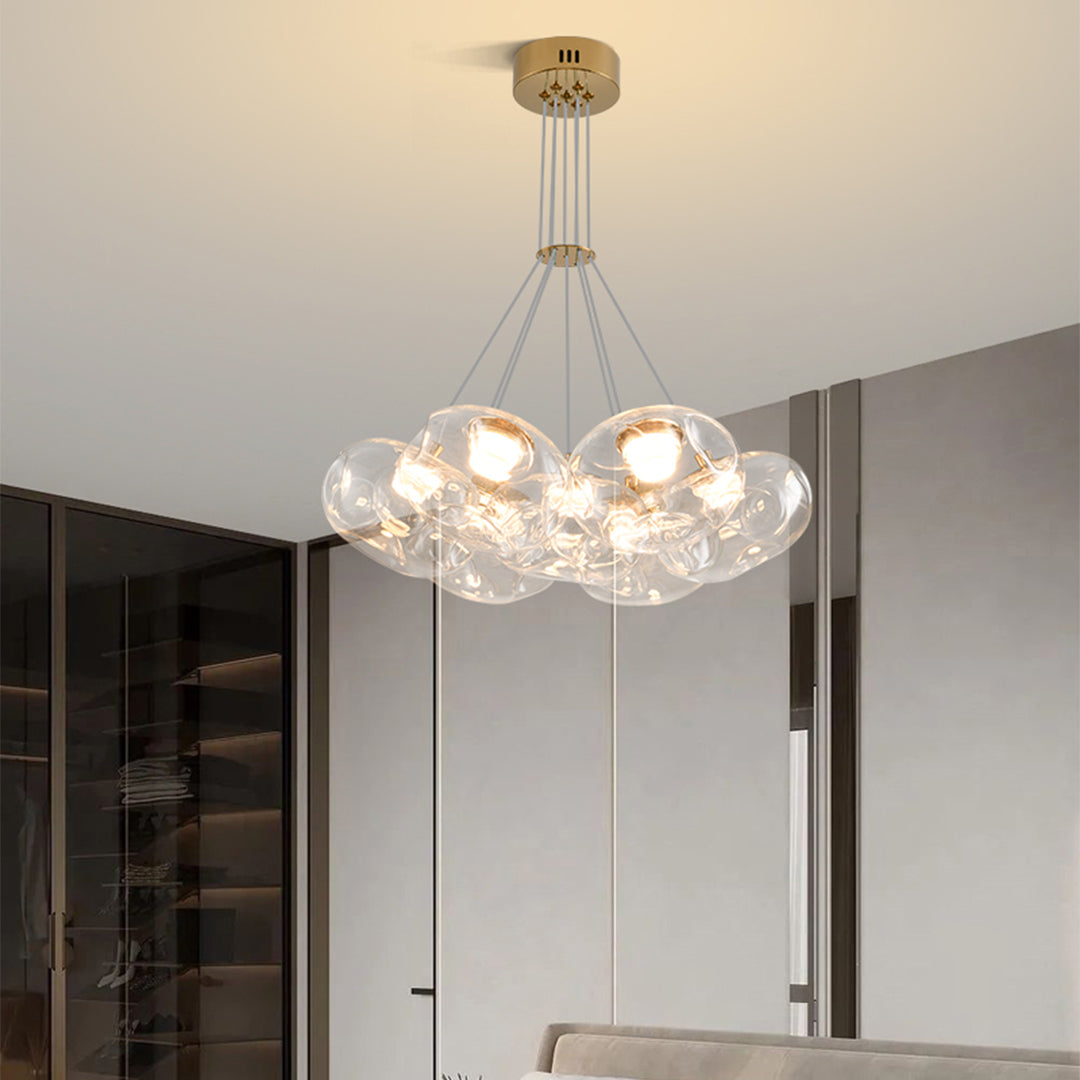 Contemporary multi light chandelier with brass accents providing sophisticated lighting in upscale interior