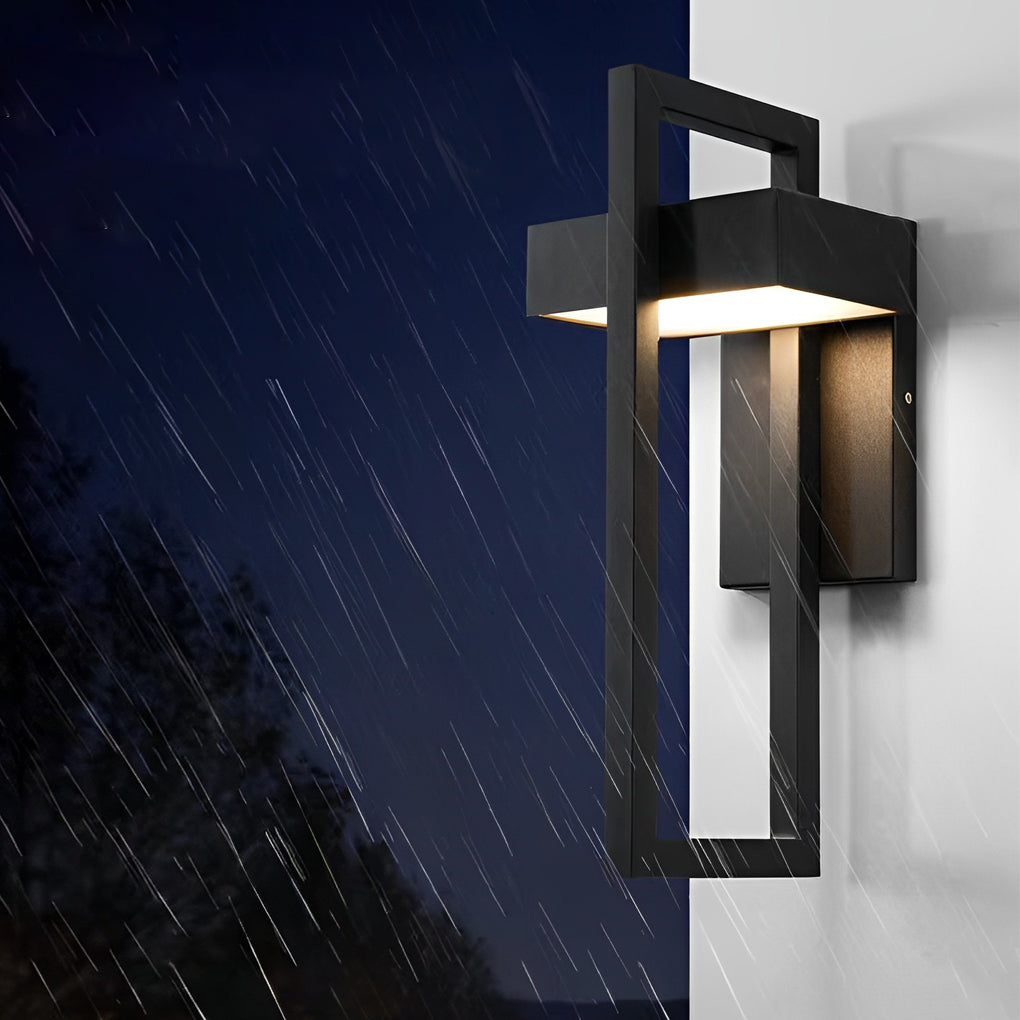 Brass black outdoor wall sconce modern mounted on an exterior wall with warm glowing illumination.