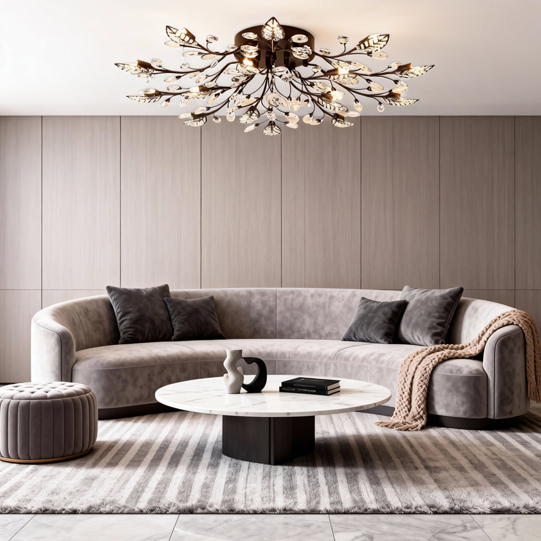 Modern brass branch chandelier illuminating a spacious living room with soft, even light.
