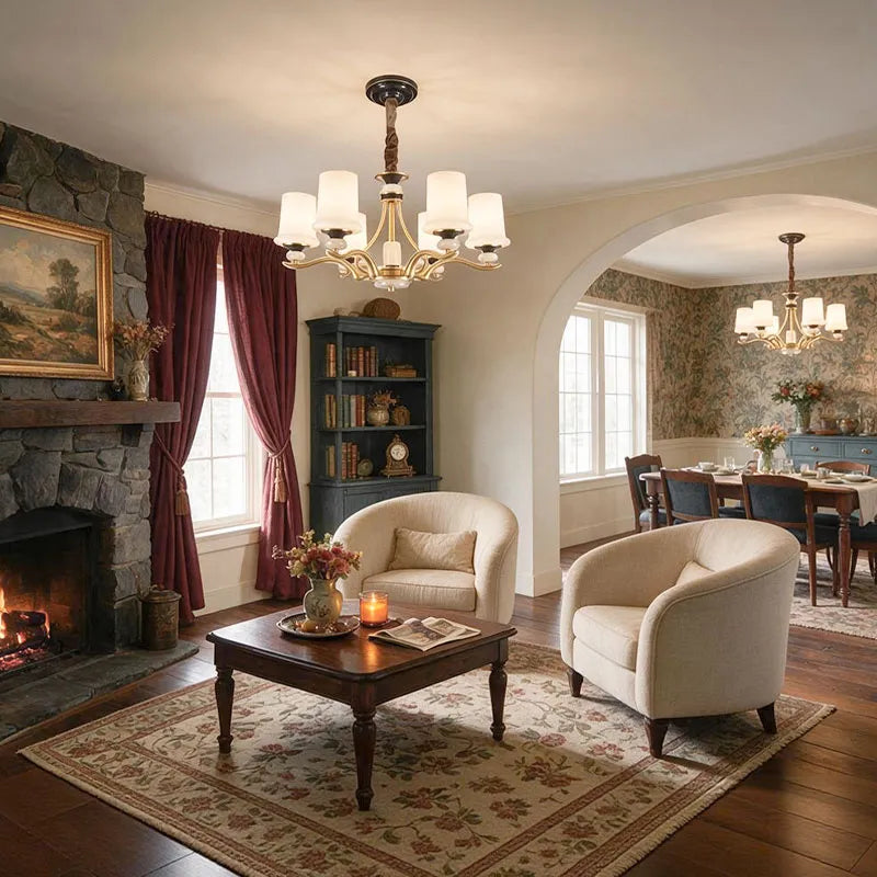 Brass candle chandelier hanging in a classic living room with curved arms and warm white shades.