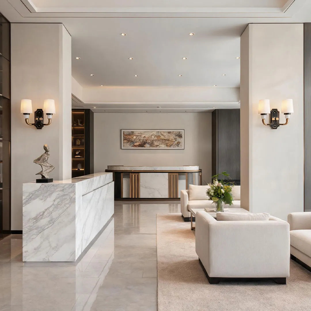 Brass candle sconces wall installed in a modern interior hallway with elegant lighting.