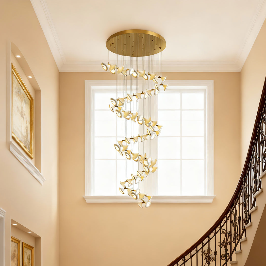 Gold ceiling plate of a modern brass ceramic chandeliers with suspension wires.