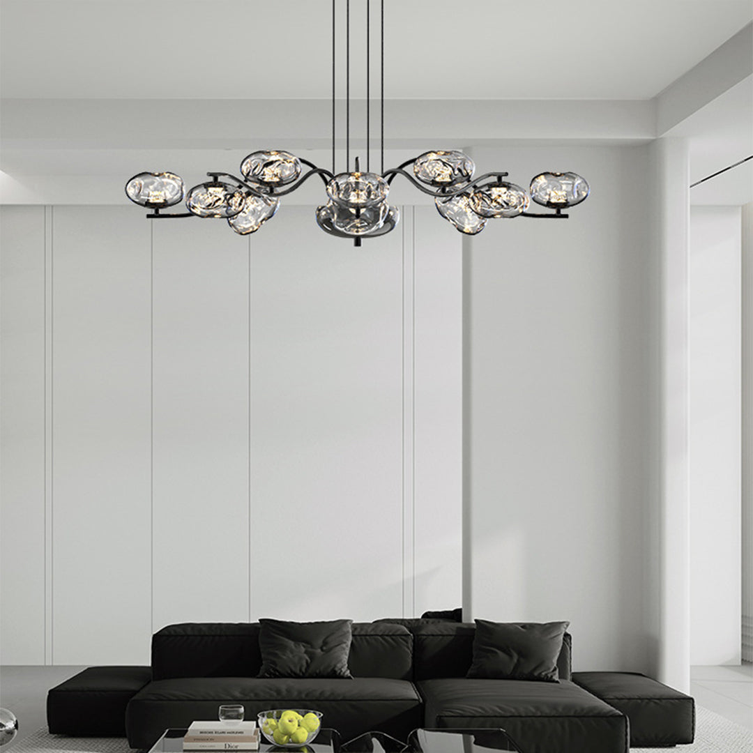 Contemporary modern LED chandelier with brass finish showcasing horizontal glass arrangement against gray backdrop