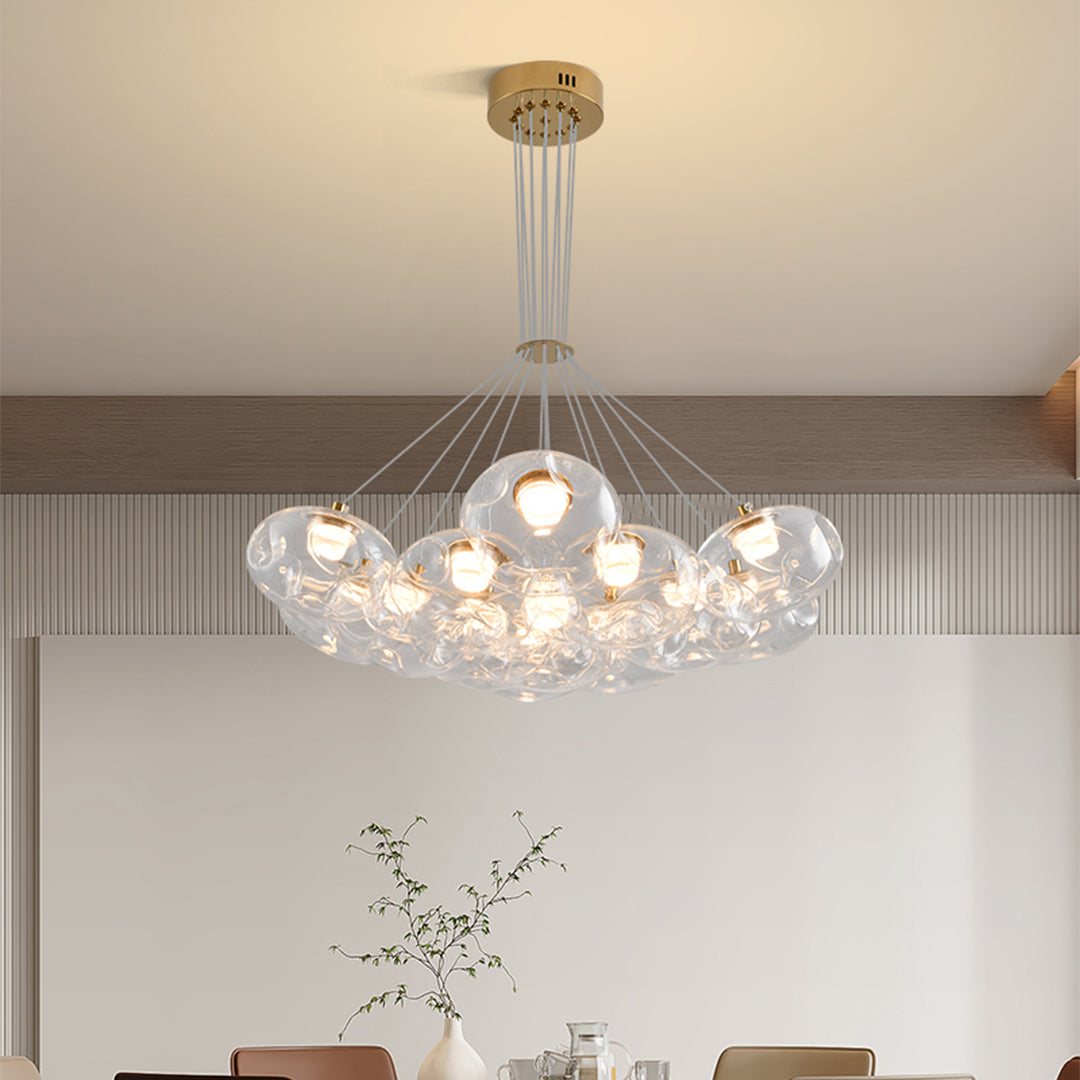 Stylish multi light chandelier with brass finish enhancing modern kitchen interior with clustered glass design