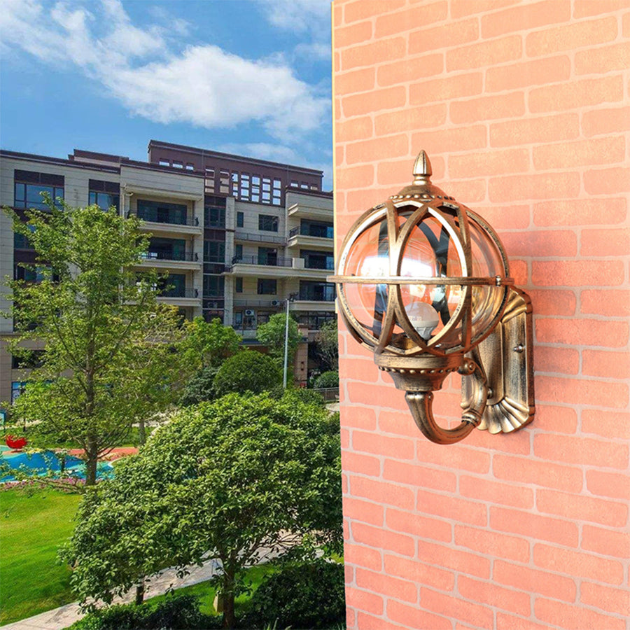 Classic nautical lantern with brass finish creating warm lighting on apartment building