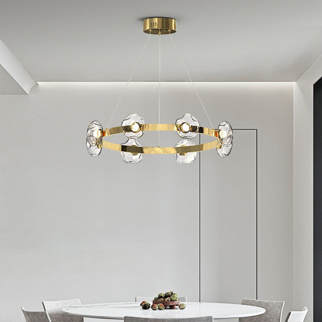 Brass ring chandelier creating warm atmospheric lighting in contemporary residential interior setting