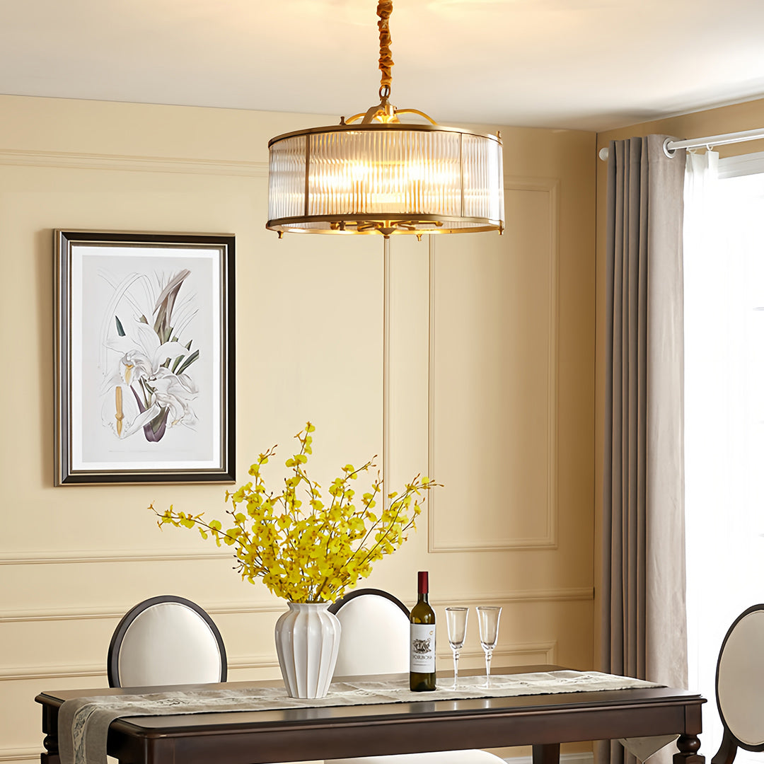 Brass semi flush mount ceiling light enhancing modern kitchen with white cabinets and large windows