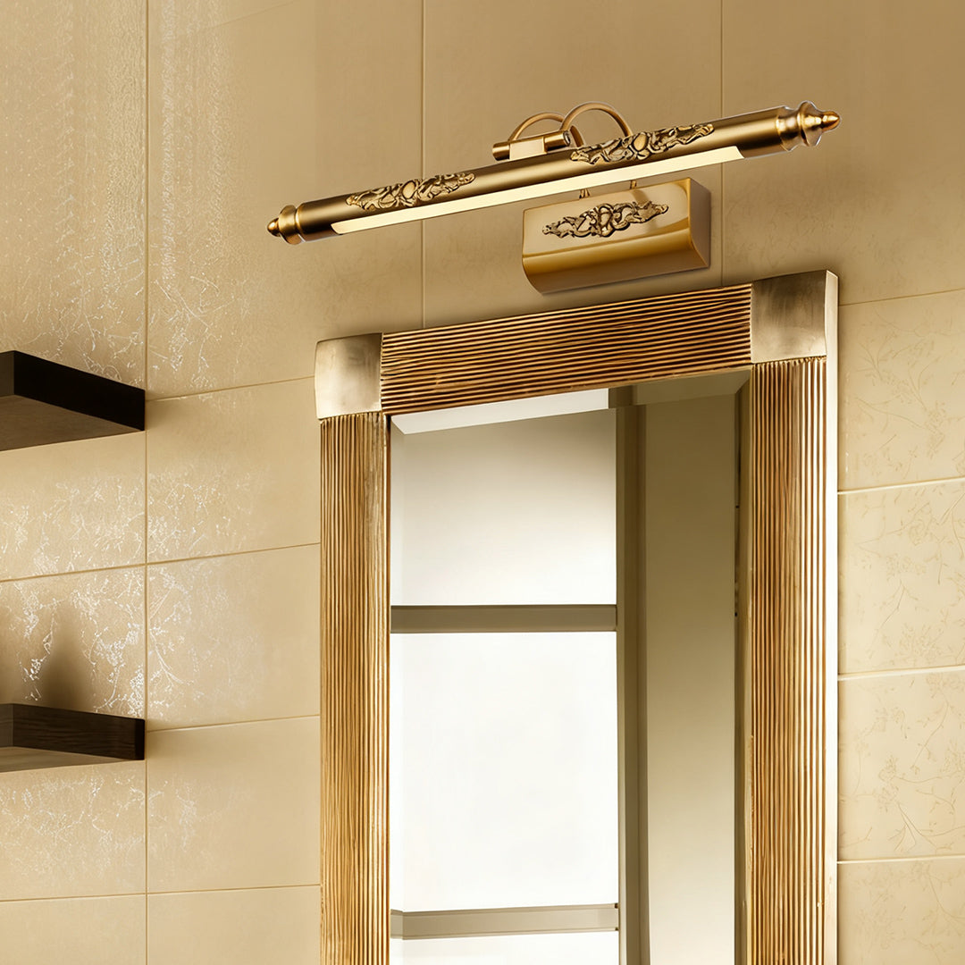 Brass bathroom vanity light fixtures illuminating hallway mirror with striped wallpaper accent