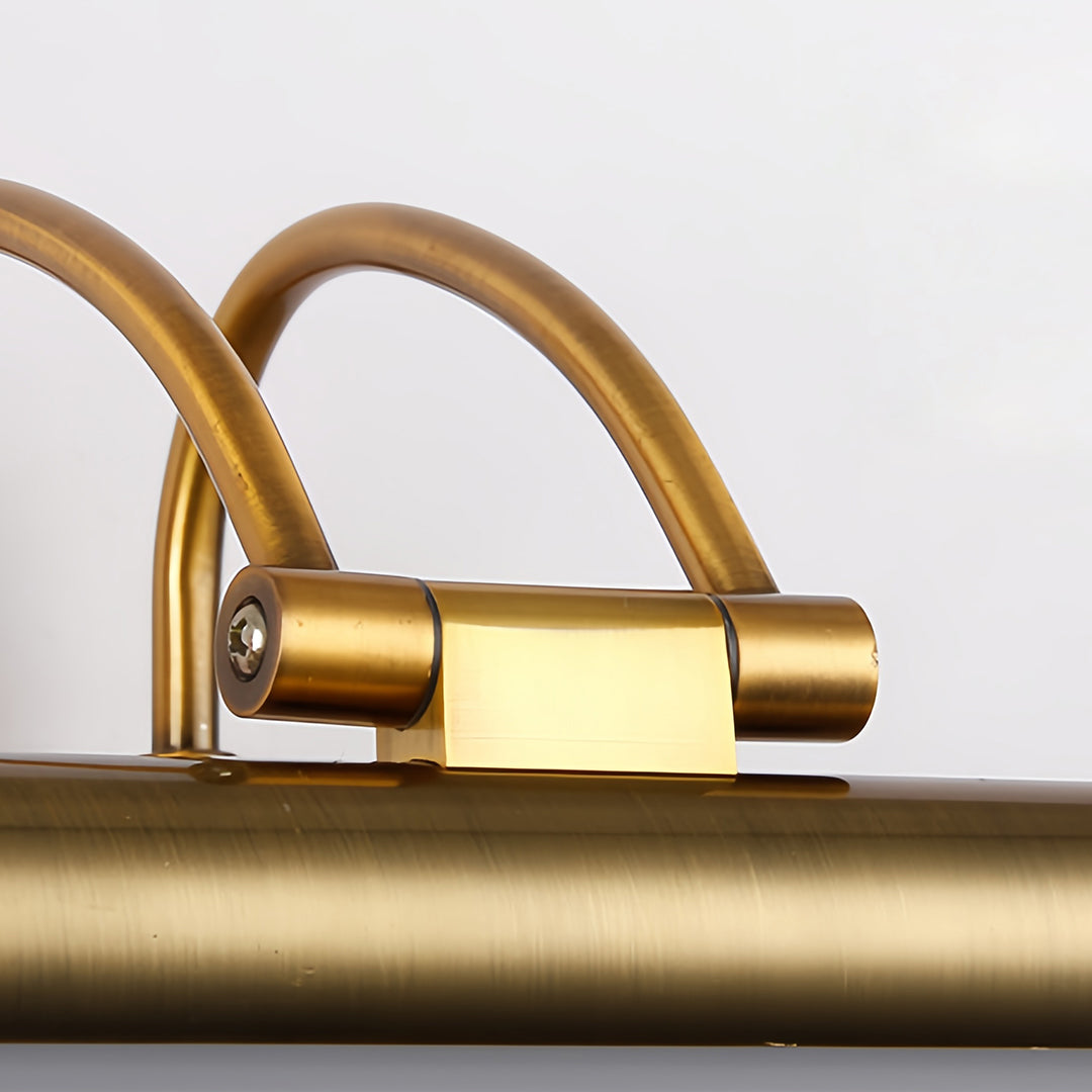 Mounting hardware detail of brass bathroom vanity light fixtures showing curved bracket design