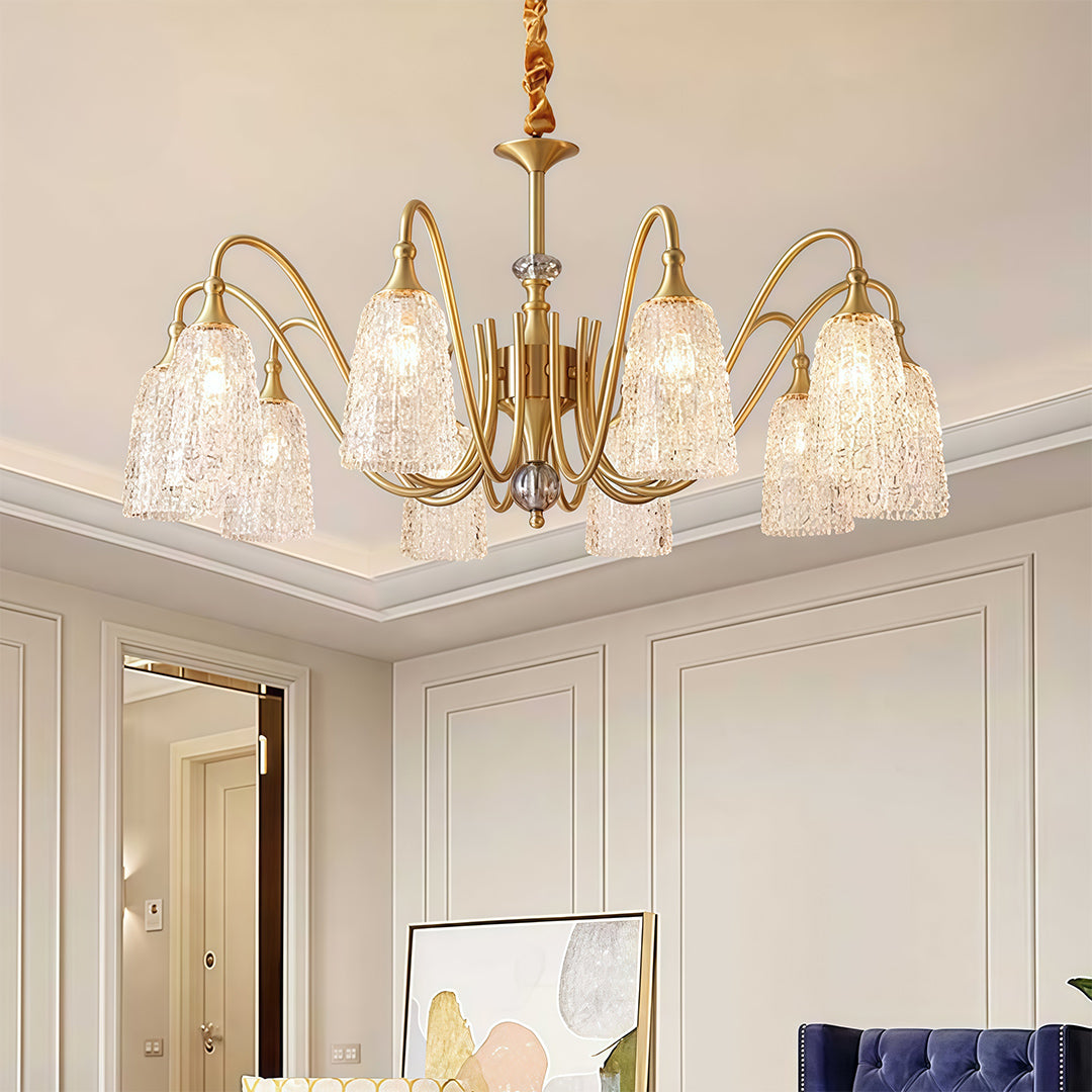 Brass vintage chandelier with intricate crystal details, showcasing a blend of antique and luxurious design.