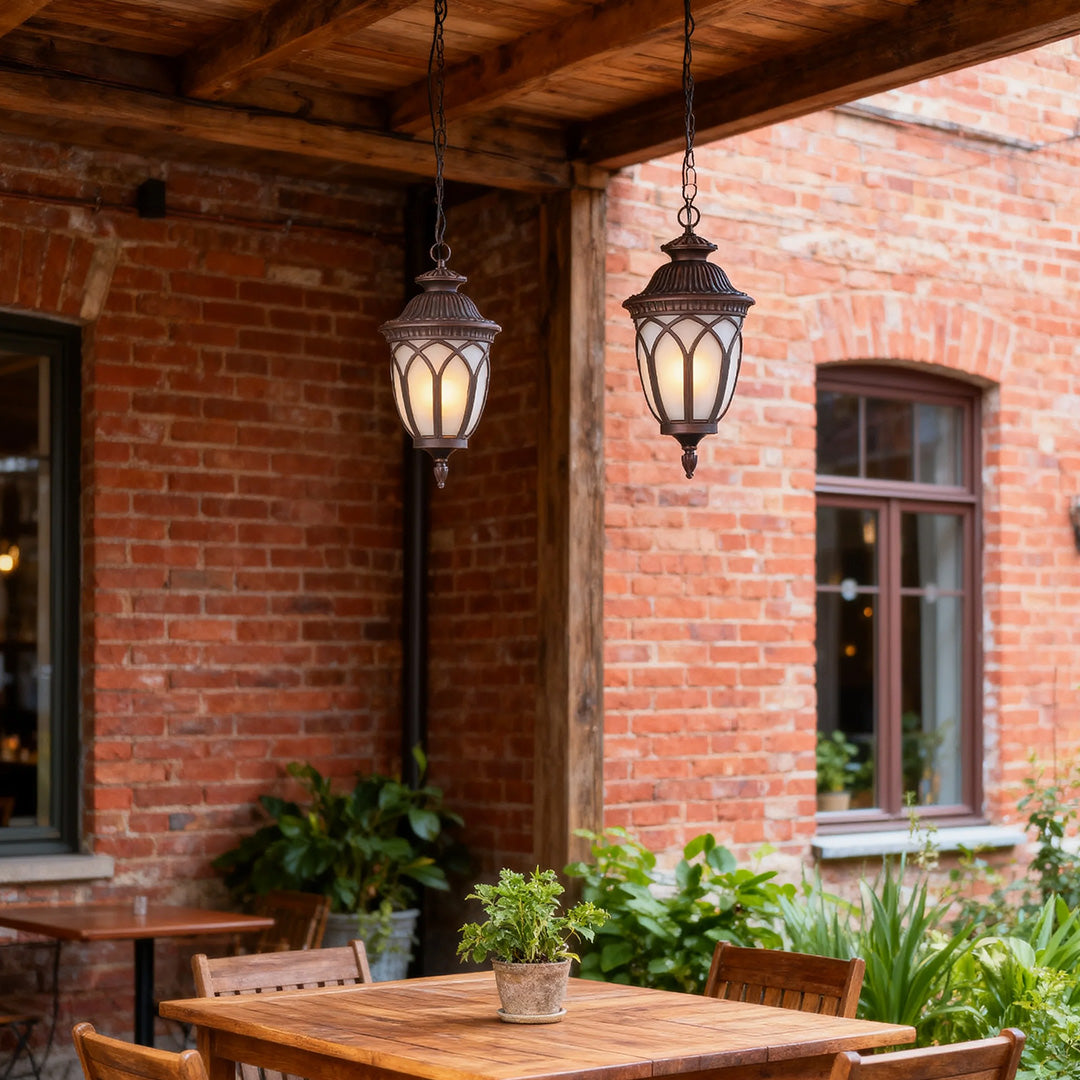 Pendant outdoor light on a brick patio, stylish and warm exterior lighting solution