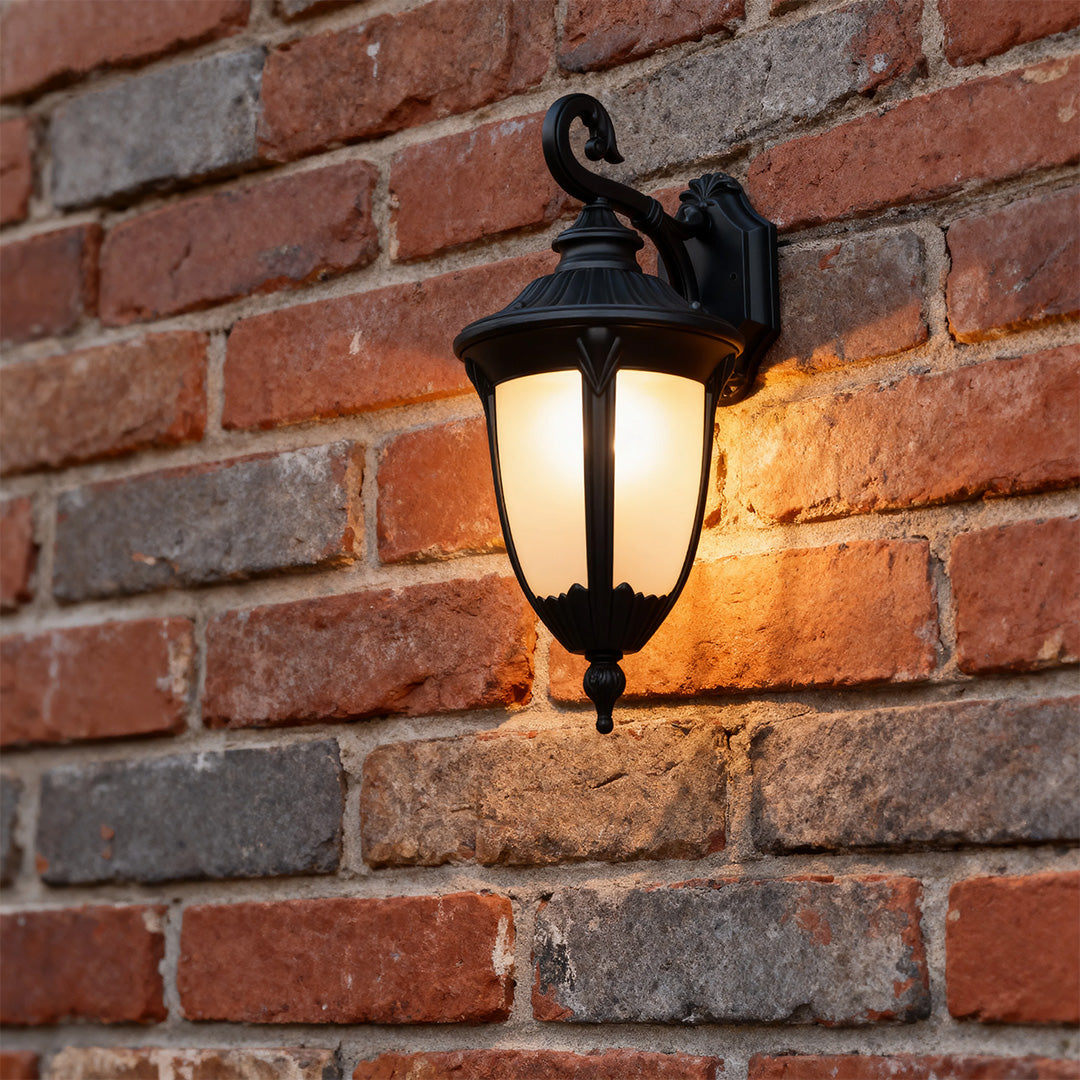 Outdoor black wall sconce on a brick wall, stylish and warm exterior lighting solution