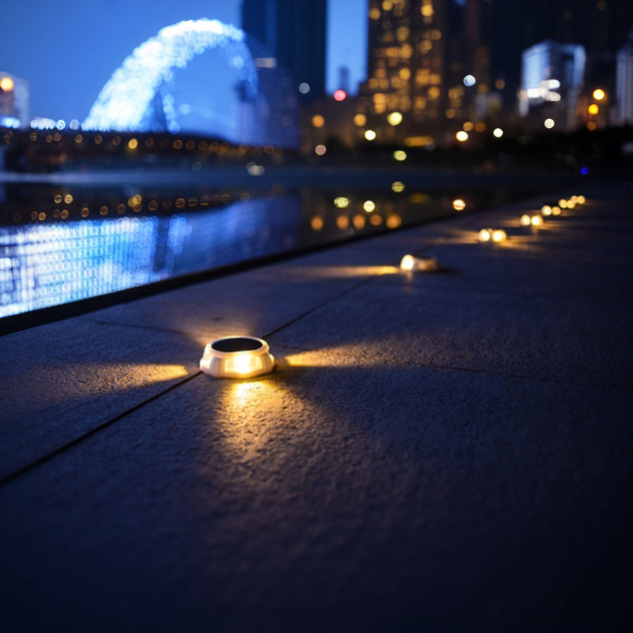 Bridge walkway illuminated by solar ground lights creating safe passage during evening hours