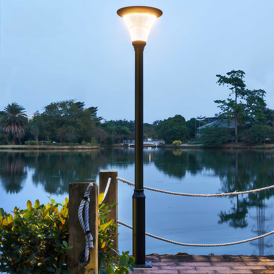 Bright commercial streetlight on a sidewalk, providing a well-lit outdoor space.