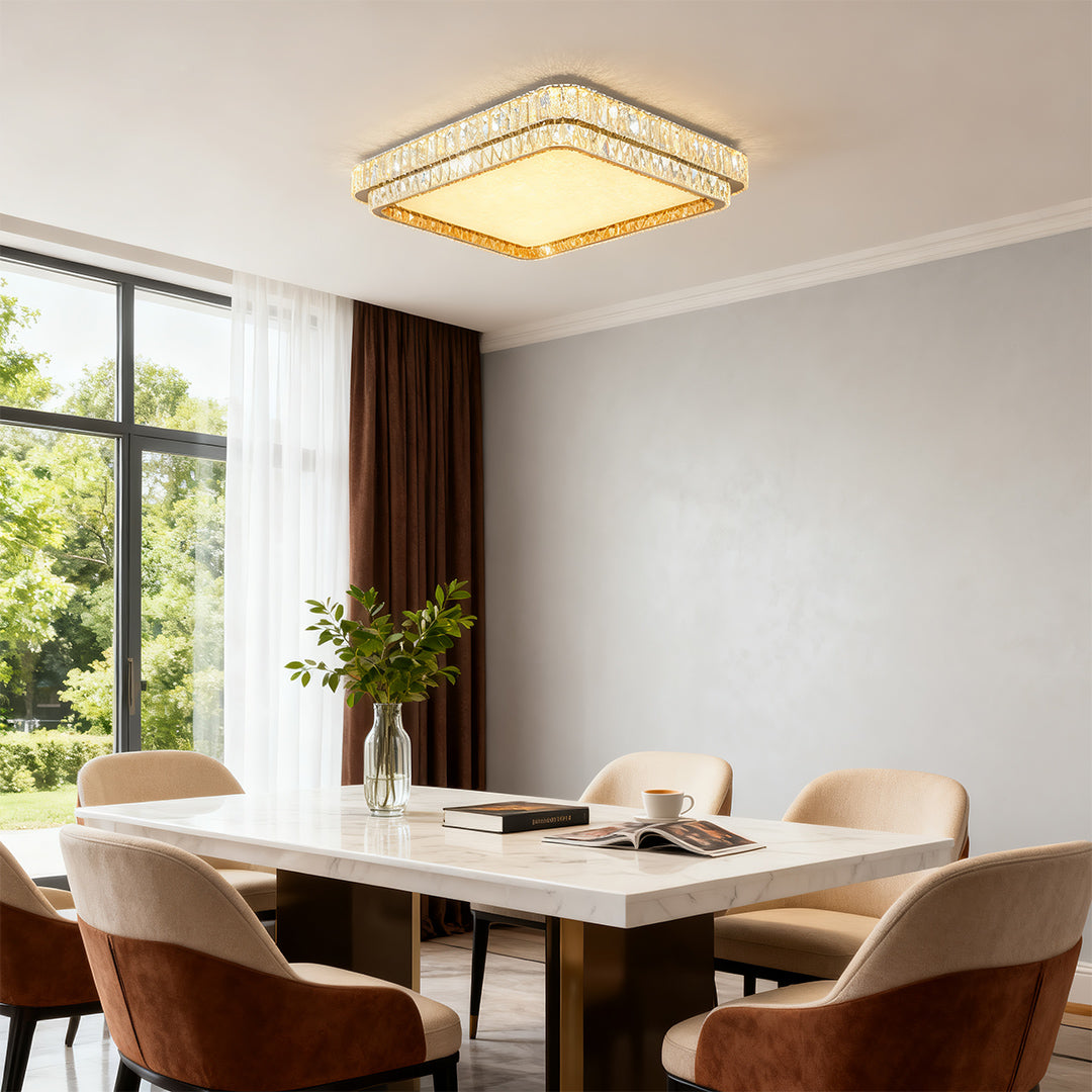 Bright contemporary flush mount lighting featuring glass shade chandelier design in airy dining room with garden views.