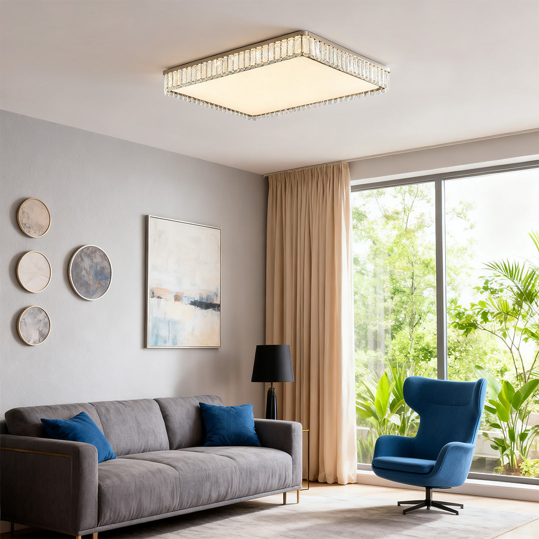 Bright flush mounted LED lights with glass shade chandelier design illuminating spacious contemporary living room with garden views.