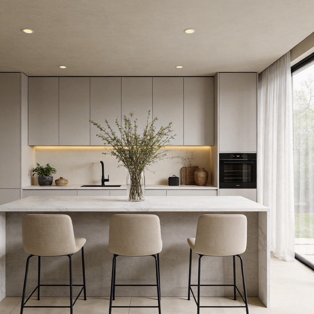 Bright kitchen with inset ceiling spotlights illuminating the entire space evenly.