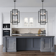 Black industrial vintage pendant light hanging in a bright living space, complementing modern decor.