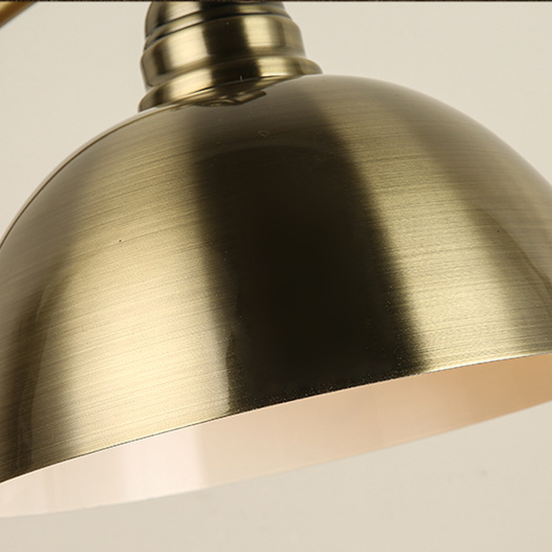 Bronze desk lamp shade interior and brushed metal finish detail.