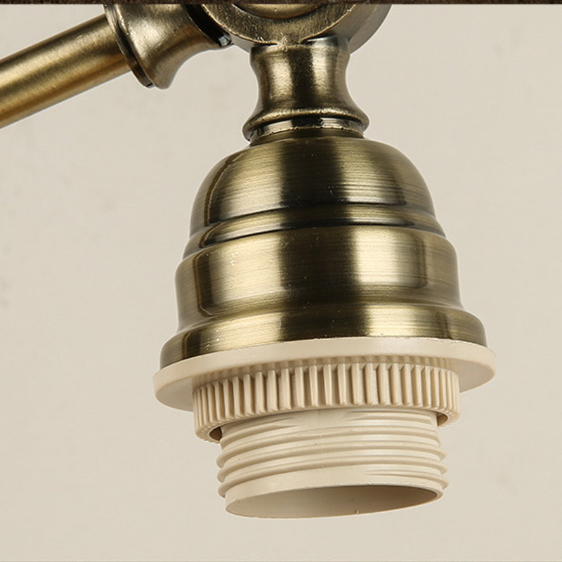 Bronze desk lamp socket and bulb holder detail.