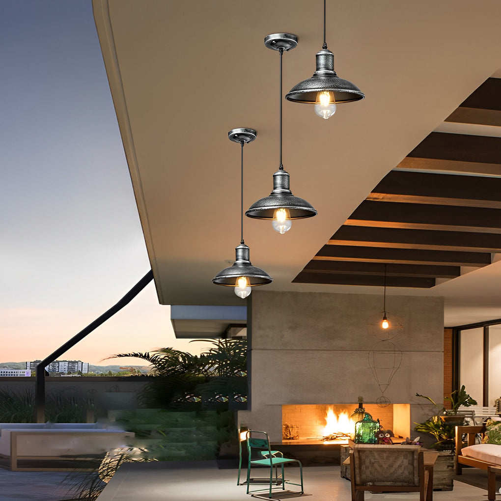 Bronze pendant lighting fixture adding a touch of elegance to a modern outdoor living space.
