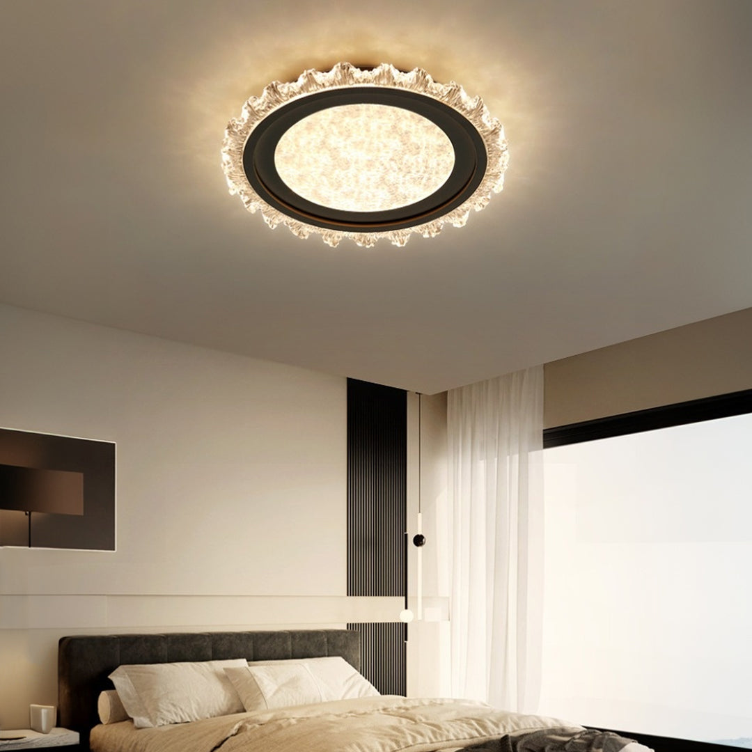 Dark bronze glass shade chandelier with decorative rim creating sophisticated bedroom atmosphere