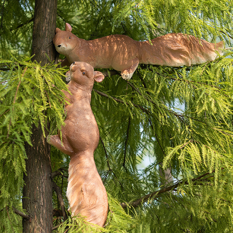 Brown solar-powered animal light in realistic squirrel shape positioned on green grass