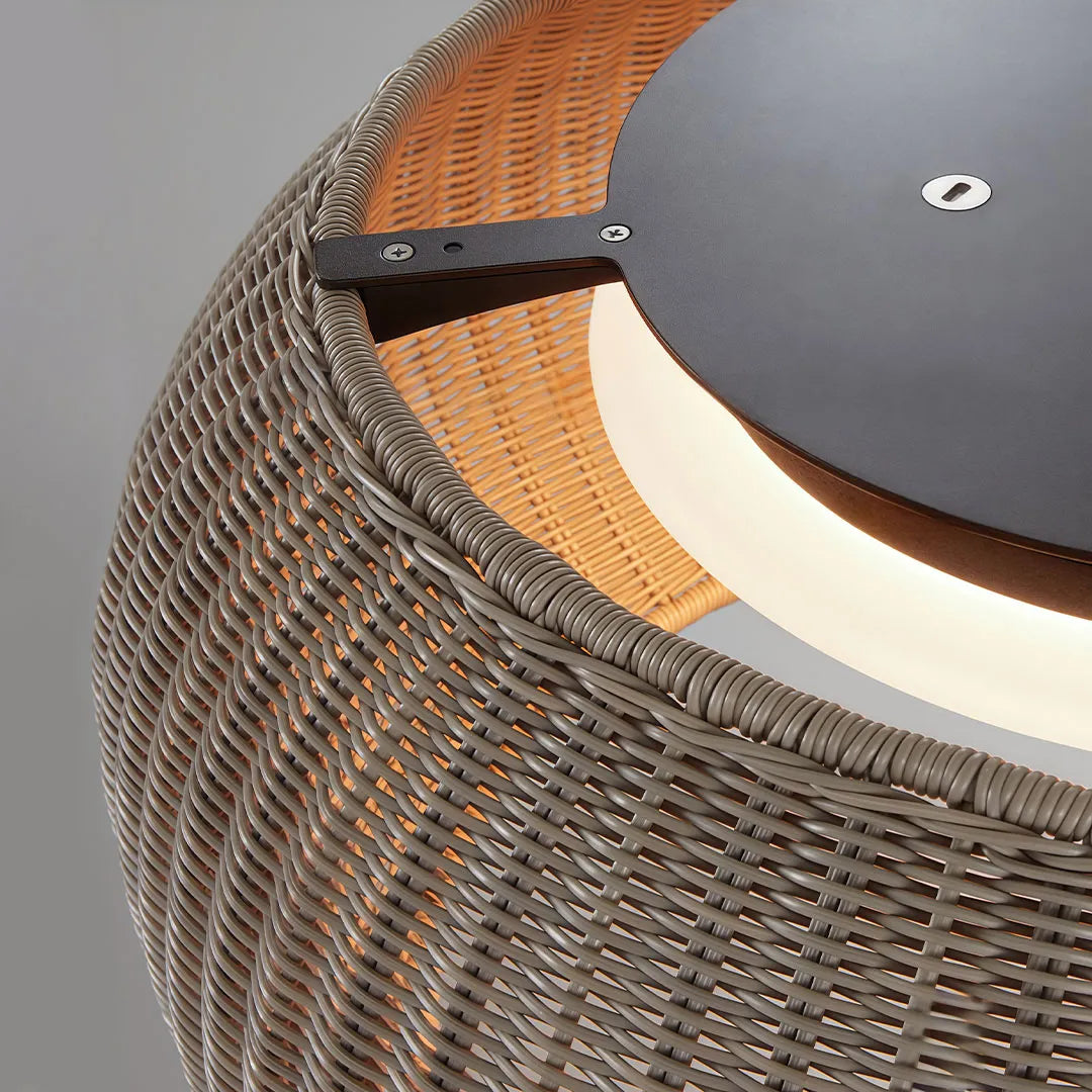 Close-up of a brown woven flush mount light with an integrated circular LED light source.