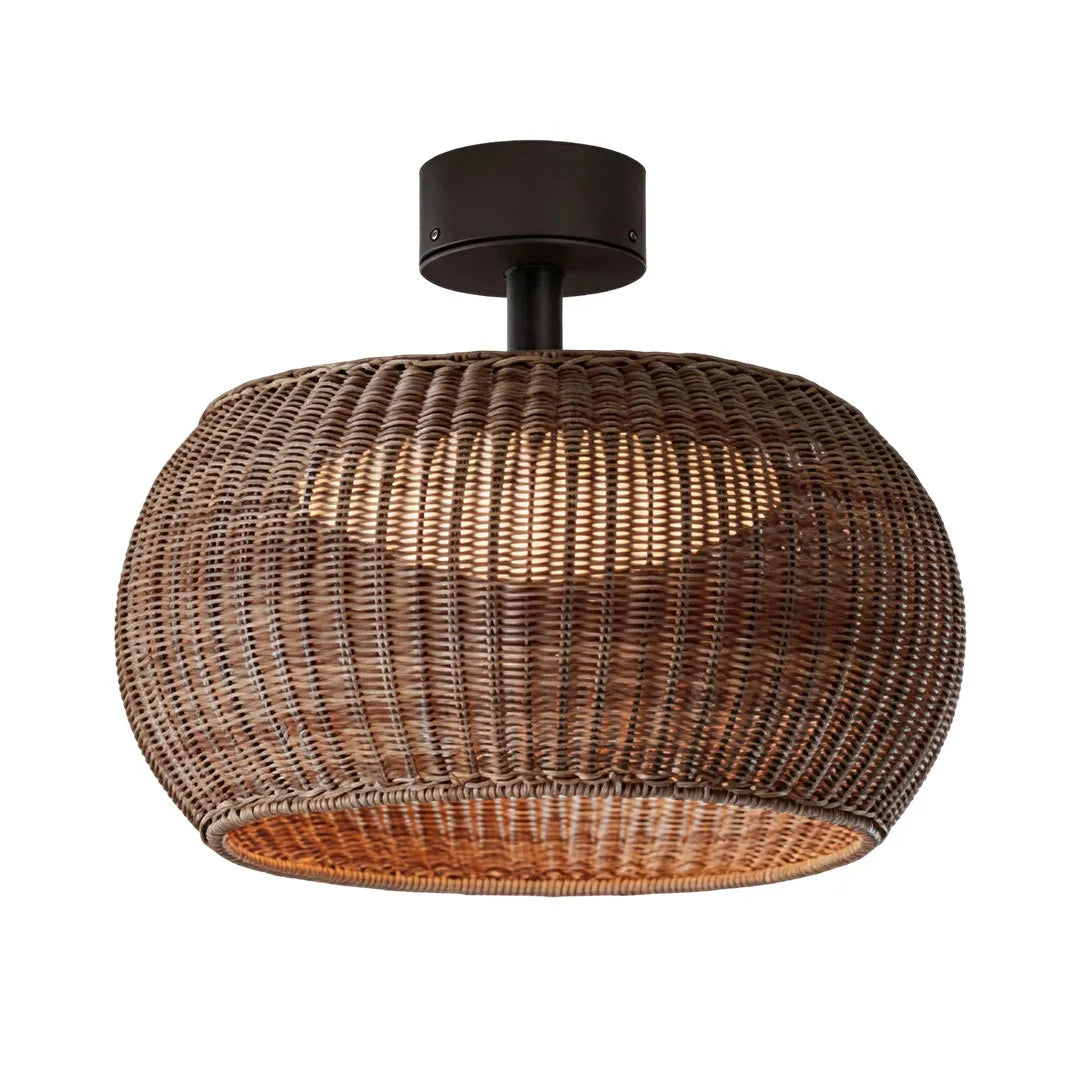 Brown woven flush mount light with a rounded wicker shade and black ceiling canopy.
